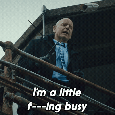 Man In Suit And Tie Saying I'm A Little F Ing Busy GIF