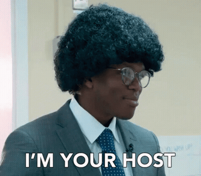 Man In Suit And Tie Saying I'm Your Host GIF