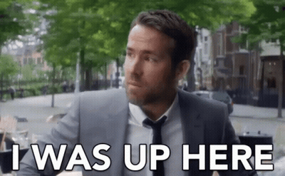 Man In Suit And Tie Saying I Was Up Here GIF