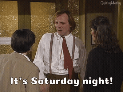Man In Suit And Tie Saying It's Saturday Night To Two People GIF