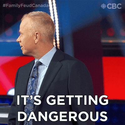 Man In Suit And Tie Saying Its Getting Dangerous GIF