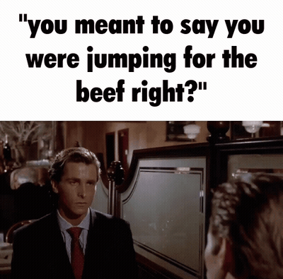 Man In Suit And Tie Saying Jumping For Beef GIF