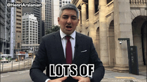 Man In Suit And Tie Saying Lots Of GIF
