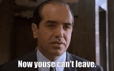 Man In Suit And Tie Saying Now Youse Can't Leave GIF