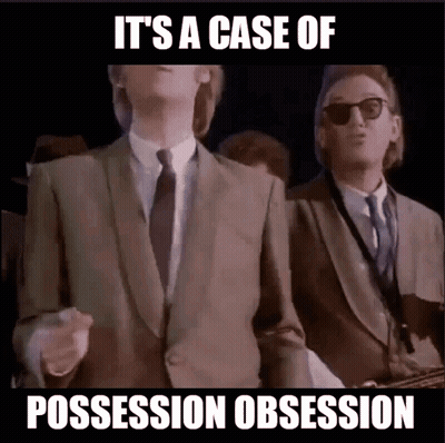 Man In Suit And Tie Saying Possession Obsession GIF