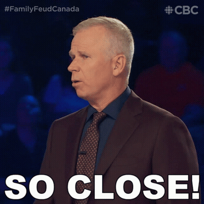 Man In Suit And Tie Saying So Close GIF