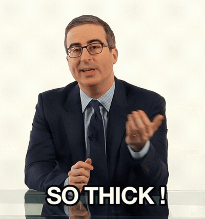 Man In Suit And Tie Saying So Thick GIF