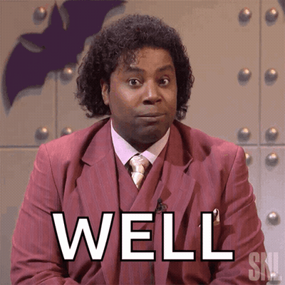 Man In Suit And Tie Saying Well GIF