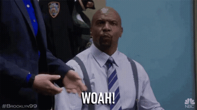 Man In Suit And Tie Saying Woah GIF