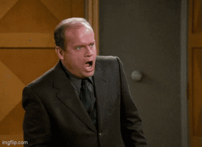 Man In Suit And Tie Saying Wounded GIF