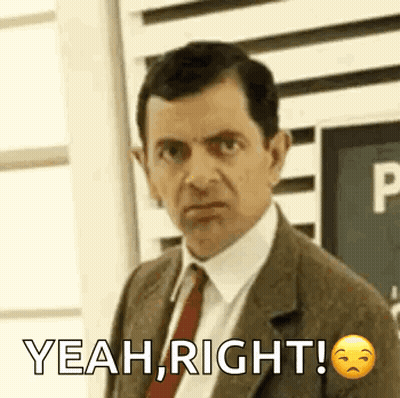 Man In Suit And Tie Saying Yeah Right GIF