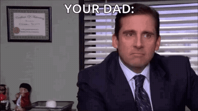 Man In Suit And Tie Saying Your Dad At Desk GIF