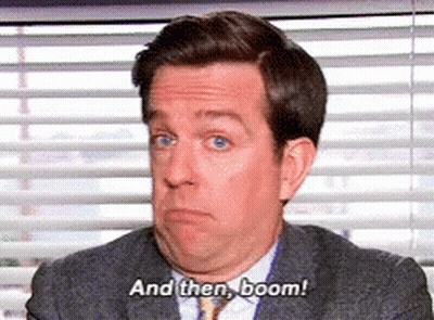 Man In Suit And Tie Says Boom GIF