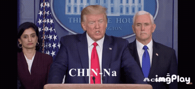 Man In Suit And Tie Says Chin Na GIF
