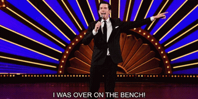 Man In Suit And Tie Says I Was Over On Bench GIF
