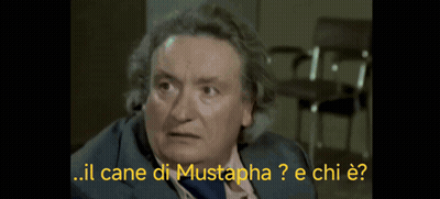 Man In Suit And Tie Says Il Cane Di Mustapha GIF