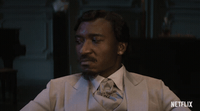 Man In Suit And Tie Says Scram GIF