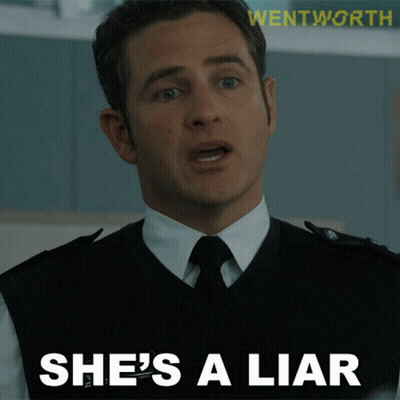 Man In Suit And Tie Says She Is A Liar GIF