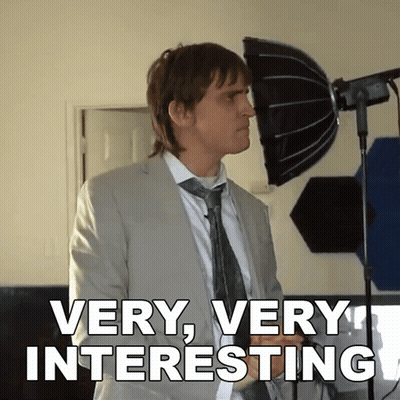 Man In Suit And Tie Says Very Very Interesting GIF