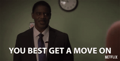 Man In Suit And Tie Says You Best Get A Move On GIF