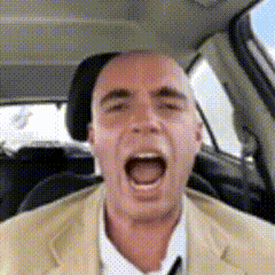 Man In Suit And Tie Screaming In Car GIF