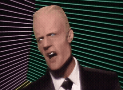 Man In Suit And Tie Screaming Into Microphone With Sunglasses GIF