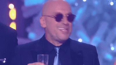 Man In Suit And Tie Screaming With Green Hard Hat GIF
