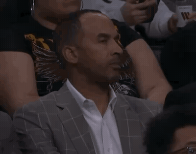 Man In Suit And Tie Shaking Hands With Basketball Player In White Shirt GIF