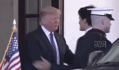 Man In Suit And Tie Shaking Hands With Marine GIF