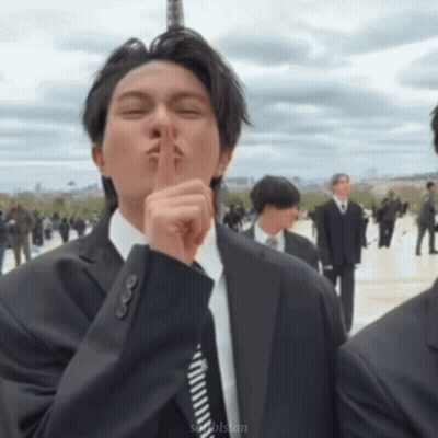 Man In Suit And Tie Shushing GIF