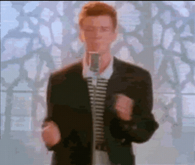 Man In Suit And Tie Singing Into Microphone GIF