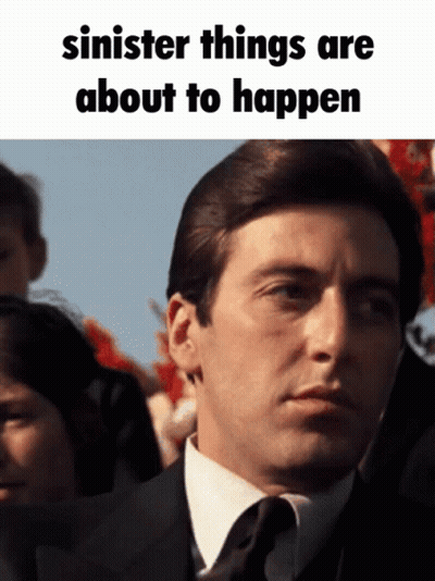 Man In Suit And Tie Sinister Things Are About To Happen GIF