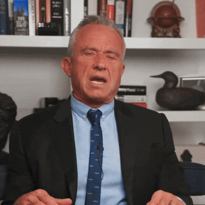 Man In Suit And Tie Sitting GIF