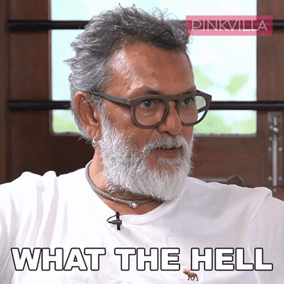 Man In Suit And Tie Sitting At Desk GIF