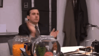 Man In Suit And Tie Sitting At Desk GIF