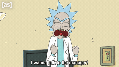 Man In Suit And Tie Sitting At Desk GIF