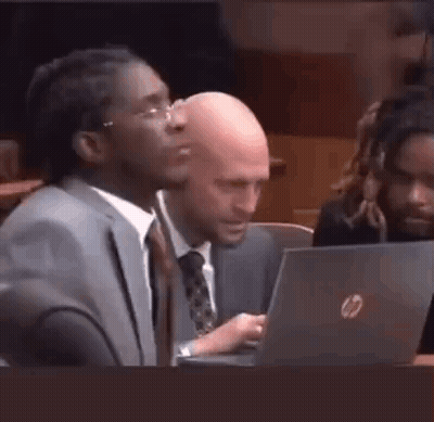 Man In Suit And Tie Sitting At Laptop GIF