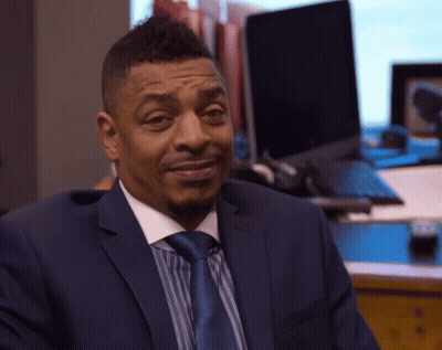 Man In Suit And Tie Sitting At Laptop GIF
