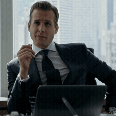 Man In Suit And Tie Sitting At Laptop GIF