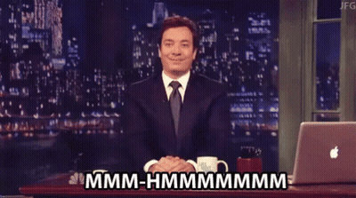 Man In Suit And Tie Sitting At Laptop Saying Hmm Hmmmm GIF