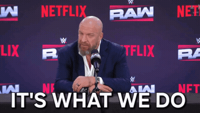 Man In Suit And Tie Sitting At Microphone GIF