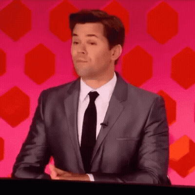 Man In Suit And Tie Sitting At Table GIF