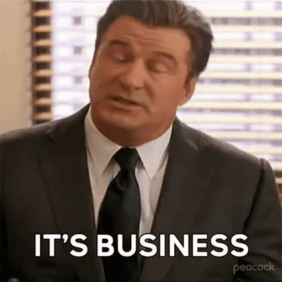 Man In Suit And Tie Sitting By Window GIF