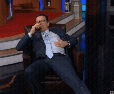 Man In Suit And Tie Sitting Cross-Legged GIF