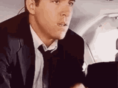 Man In Suit And Tie Sitting In Airplane GIF