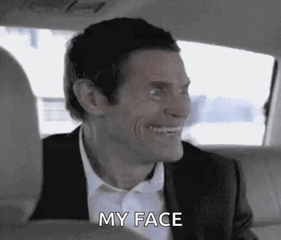 Man in Suit and Tie Sitting in Back Seat of Car