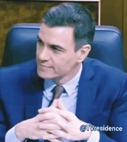 Man in Suit and Tie Sitting in Chair