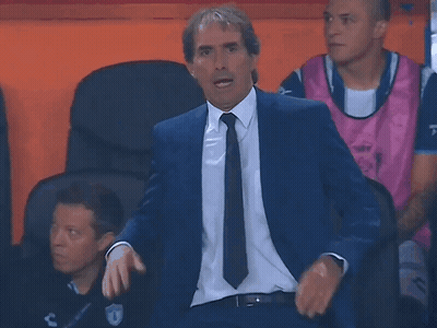 Man In Suit And Tie Sitting In Chair GIF