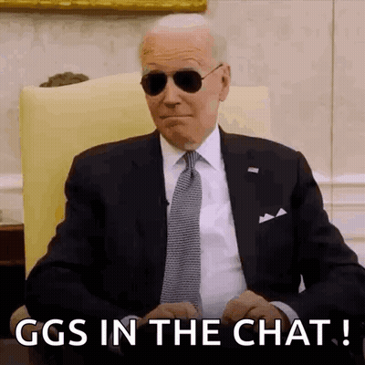 Man In Suit And Tie Sitting In Chair GIF