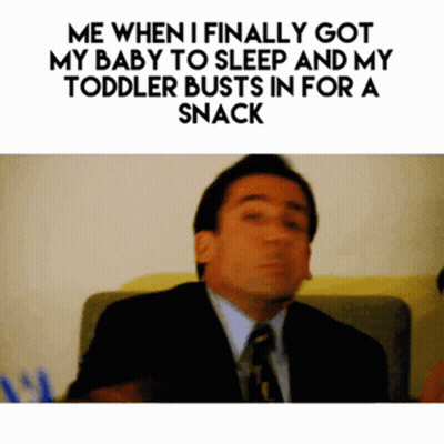 Man In Suit And Tie Sitting On Couch GIF